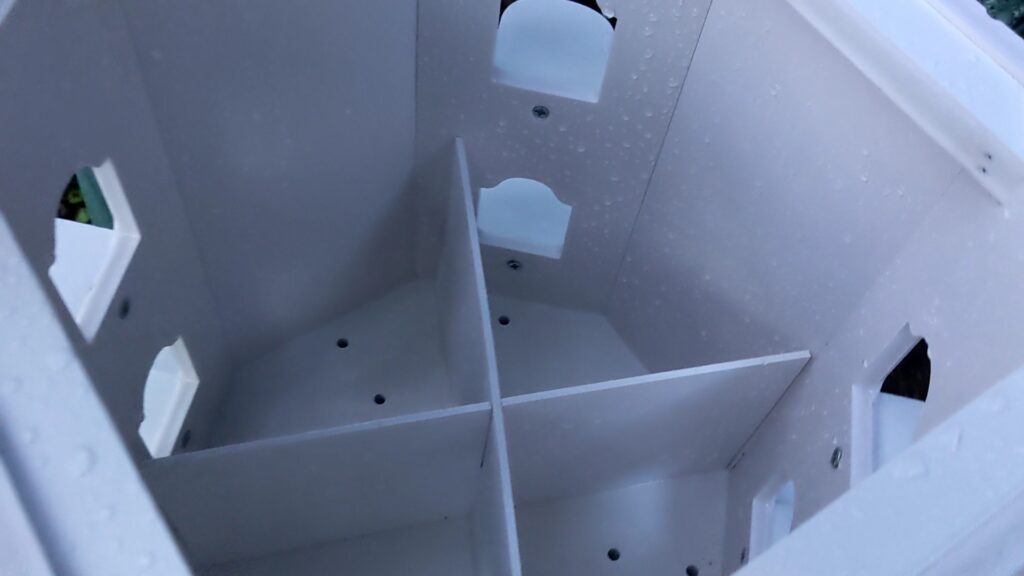 the innards of the 8 compartment birdhouse are removable for easy access to installation and cleaning
